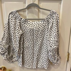 White blouse with black polka dots
